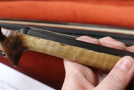 A silver mounted violin bow, an ivory mounted violin bow and a late 19th century German violin, cased